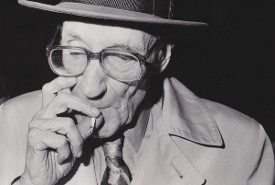 William Burroughs smokes a joint at the Prop Theatre in Chicago October 1988 photo by Richard Alm