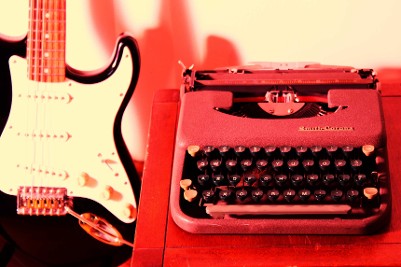 Guitar and typewriter - Moresby Press image